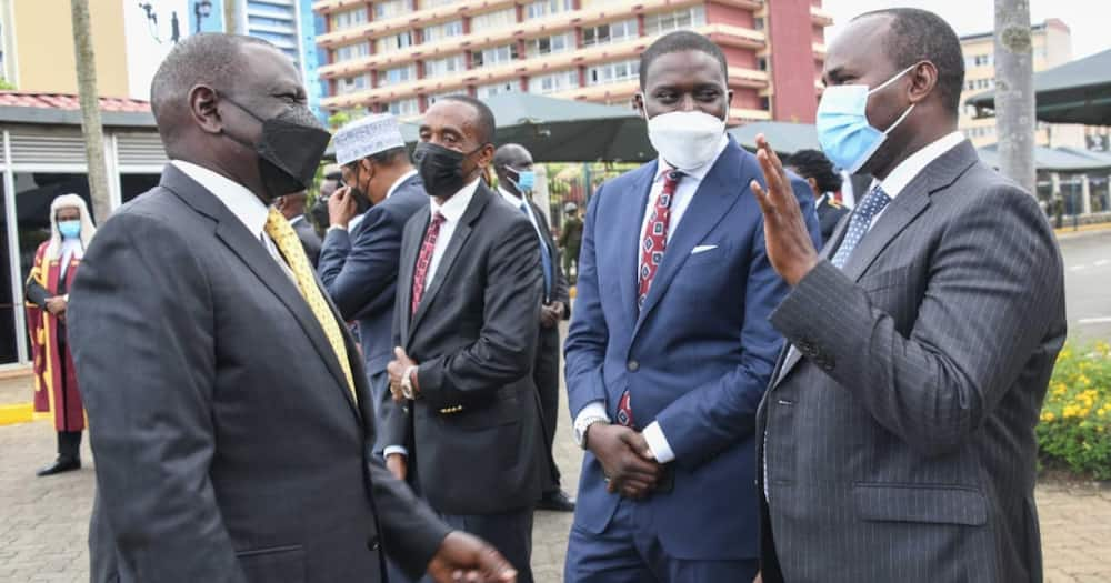 William Ruto with legislators at parliament buildings.