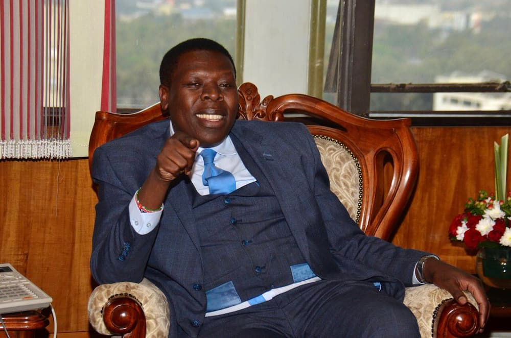 Mike Sonko, CS Wamalwa elbow bump during transfer of Nairobi function to nation gov't