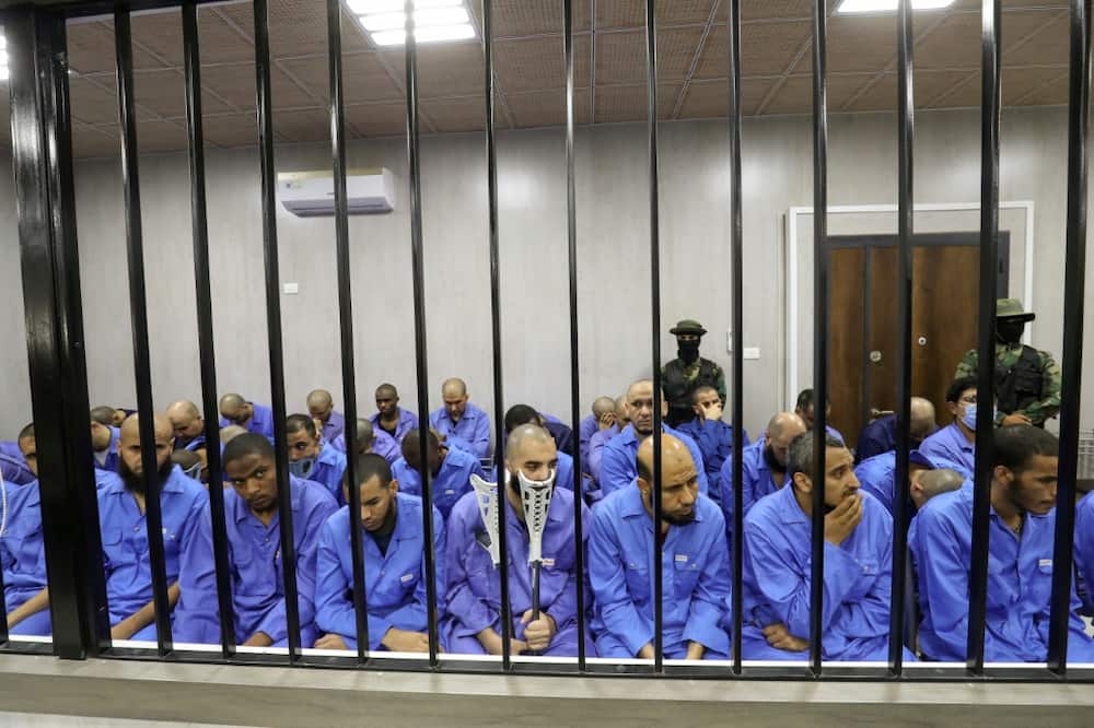 Suspected members of the Islamic State group sit in the dock during their trial in the western Libyan city of Misrata