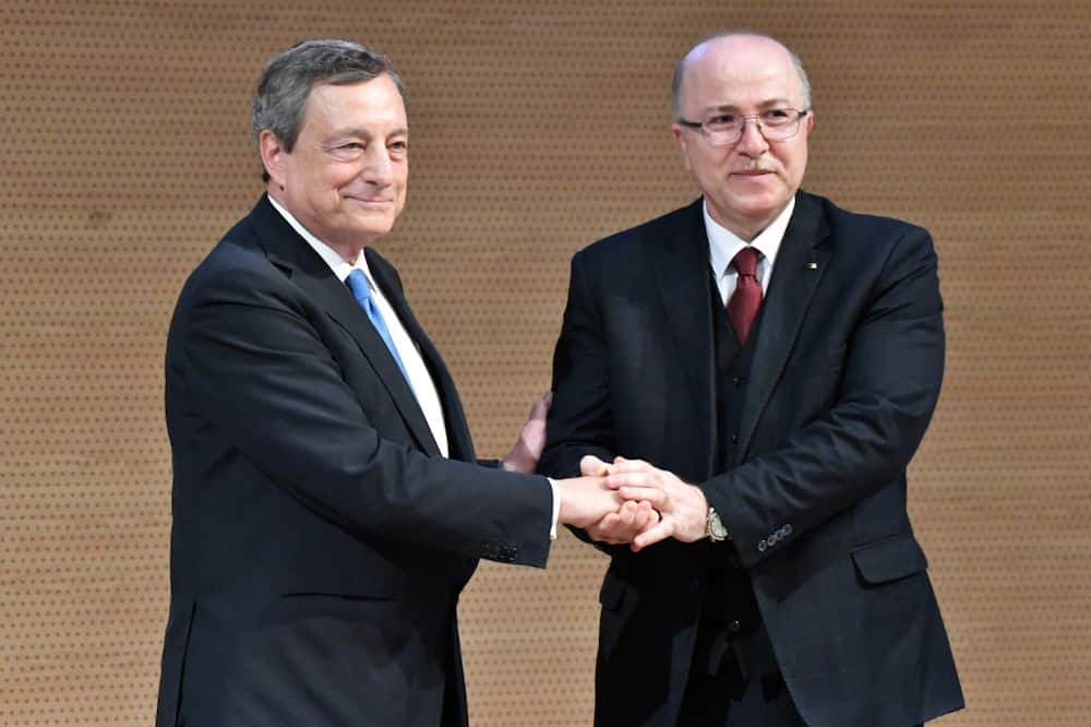 Italian Prime Minister Mario Draghi (L) and Algeria's Prime Minister Aimene Benabderrahmane shake hands in Algiers. Algeria is Africa's biggest gas exporter and supplies around 11 percent of the natural gas consumed in Europe