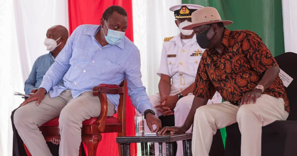 President Uhuru Kenyatta and ODM leader Raila Odinga sharing a word. Photo: State House Kenya.