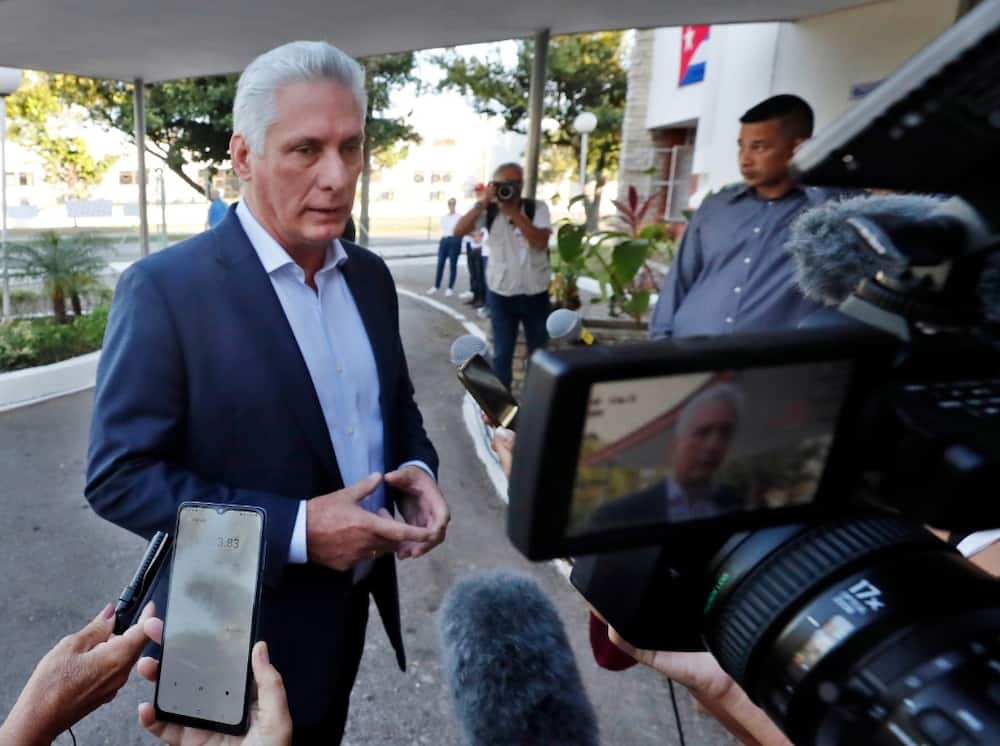 Cuban President Miguel Diaz-Canel speaks to reporters after casting his vote in municipal elections in Havana on November 27, 2022