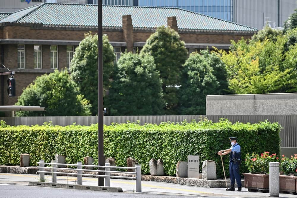A policeman patrols a road leading to the residence and office of Japan's prime minister last year