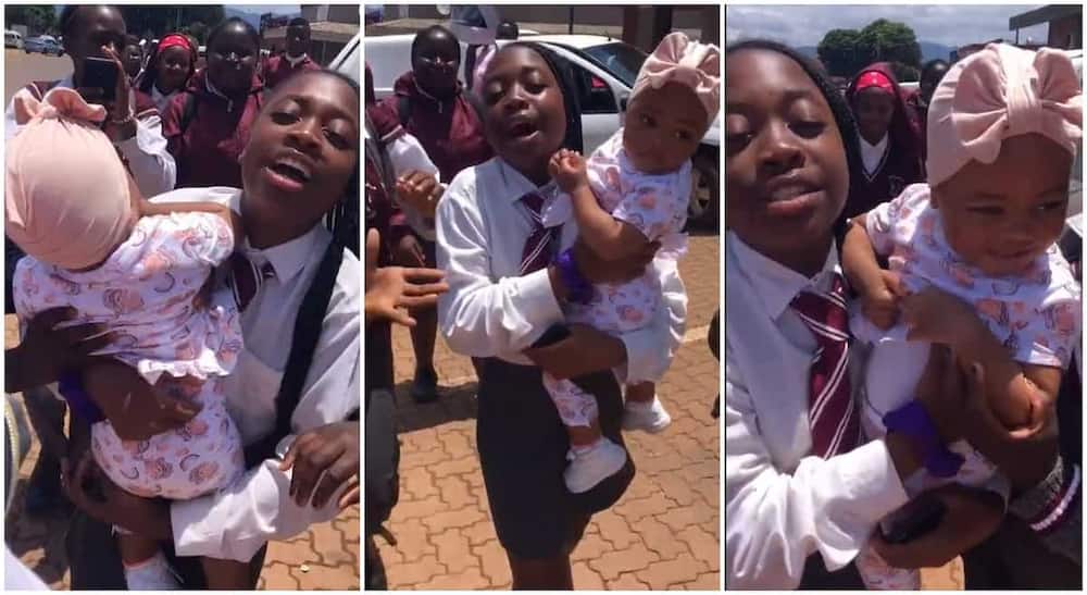 Photos of a student holding a fine baby.