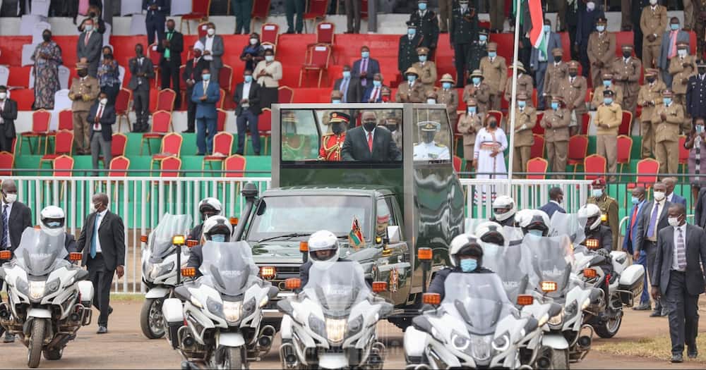 President Uhuru Kenyatta atop his ceremonial Land Rover.