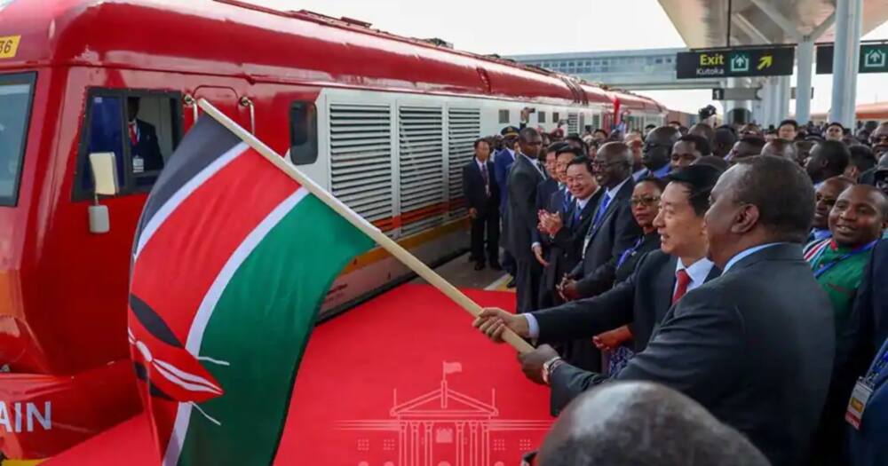 President Uhuru Kenyatta flags off a train to Ngong. Photo: State House.