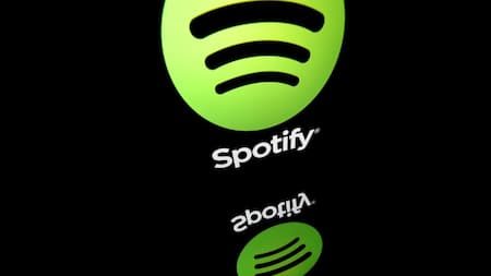 Spotify swings to profit, paying subscribers rise