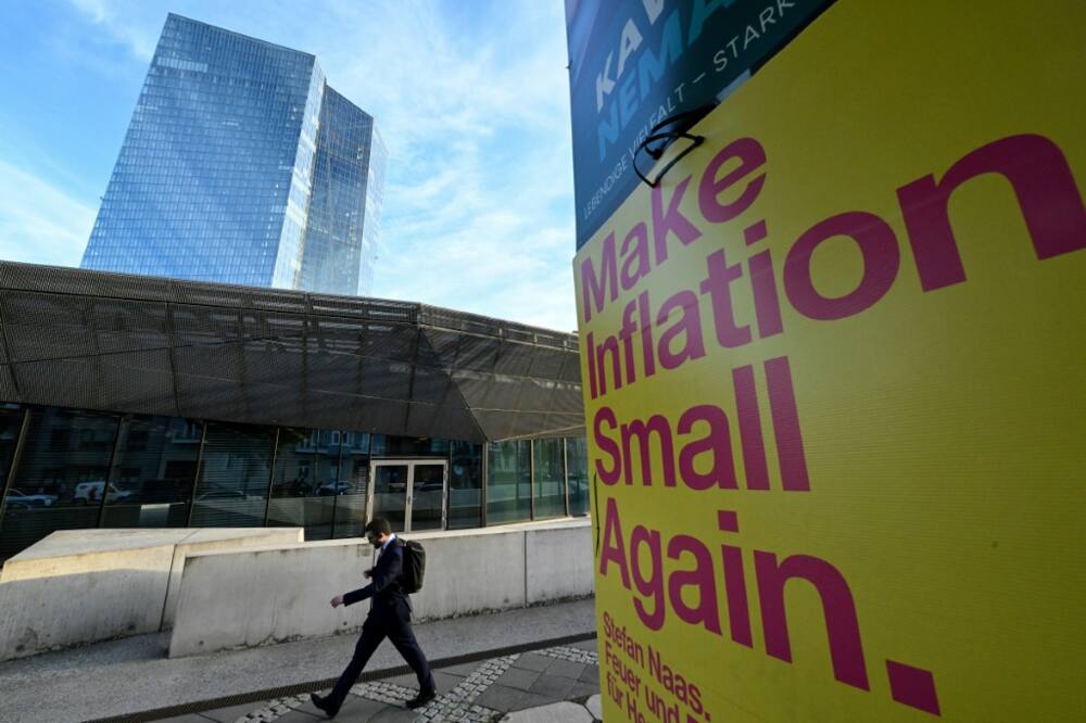 A banner reads "Make Inflation Small Again" next to the European Central Bank building in Frankfurt