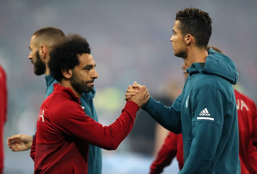 Mohamed Salah and Ronaldo in action on the pitch