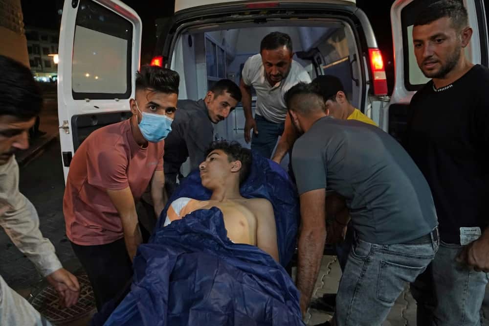 The injured from the bombardment are taken to hospital in the Kurdish town of Zakho in northern Iraq