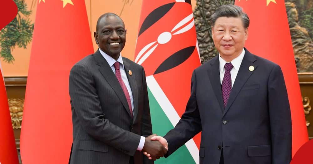 President William Ruto shakes hands with Chinese president Xi Jinping.