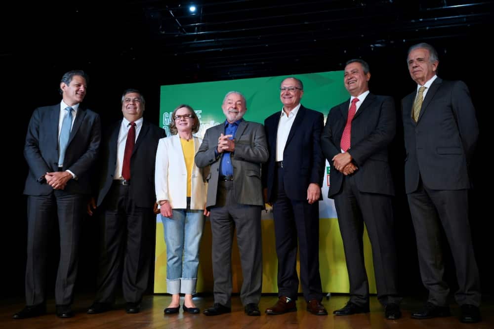 Brazil's President-elect Luiz Inacio Lula da Silva (C) poses for a picture alongside allies he named to head key ministries
