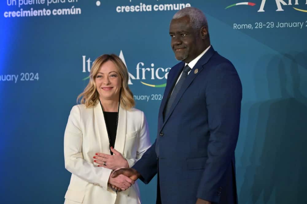Italy's Prime Minister, Giorgia Meloni welcomes  Chairperson of the African Union Commission Moussa Faki Mahamat as he arrives for the Italy-Africa international conference 'A bridge for common growth’ at the Italian Senate in Rome on January 29, 2024.
