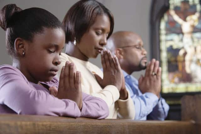 black people praying in church