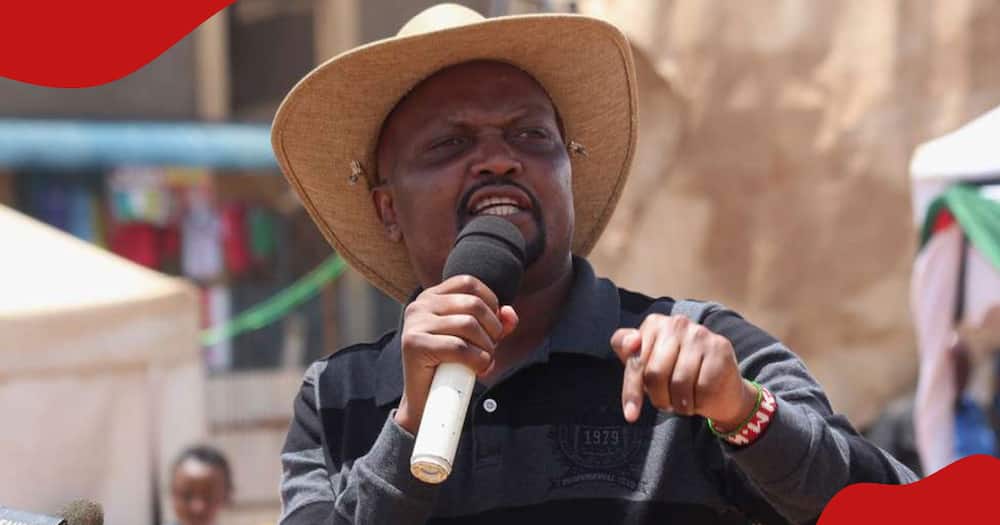 Moses Kuria speaks at an event.