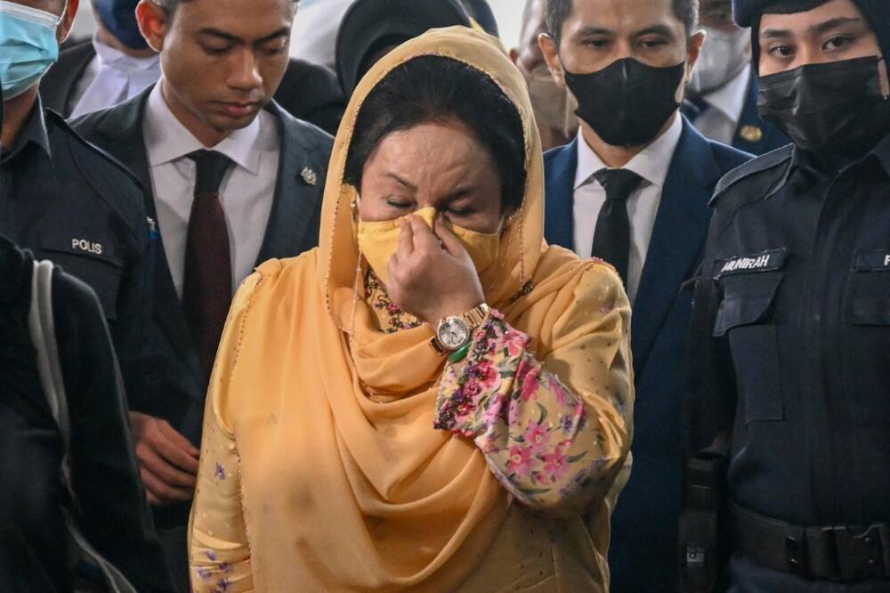 Rosmah Mansor (C), the wife of jailed former Malaysian PM Najib Razak, has been found guilty of corruption