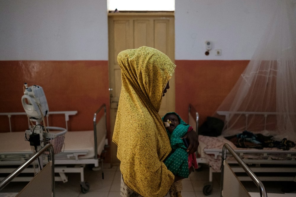 After four failed rainy seasons, Somalia, Kenya and Ethiopia are in the worst drought for 40 years: a mother cradles her child suffering from severe malnutrition a hospital in the Somali city of Baidoa on November 9