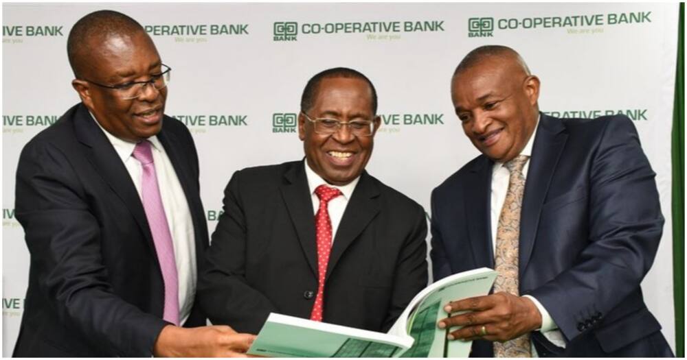 Group Managing Director & CEO Dr Gideon Muriuki together with Bank Chairman Mr John Murugu and the Vice-Chairman Mr Macloud Malonza go through Co-op Bank’s Annual Report during the bank’s 14th Annual General Meeting on May 27, 2022.