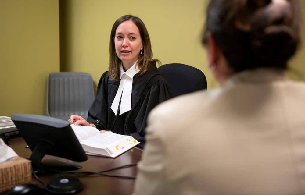 This simulation of a lawyer discussing a complaint of sexual assault or domestic violence with the victim is part of the training under way in Salaberry-de-Valleyfield, Canada, before a specialized court for the sensitive proceedings opens in Quebec