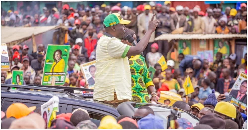 Man addressing a crowd.