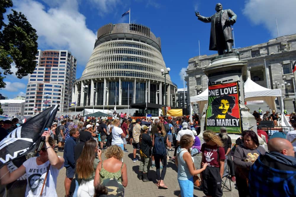 Anti-vaccine demonstrators occupy the grounds surrounding the parliament building in Wellington, New Zealand, on February 22, 2022