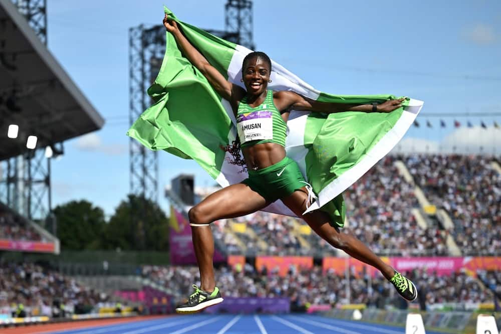 Nigeria's Tobi Amusan celebrates her gold medal in the women's 100m hurdles