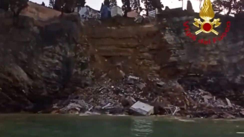 Hundreds of coffins fall into the sea after landslide causes collapse of cemetery