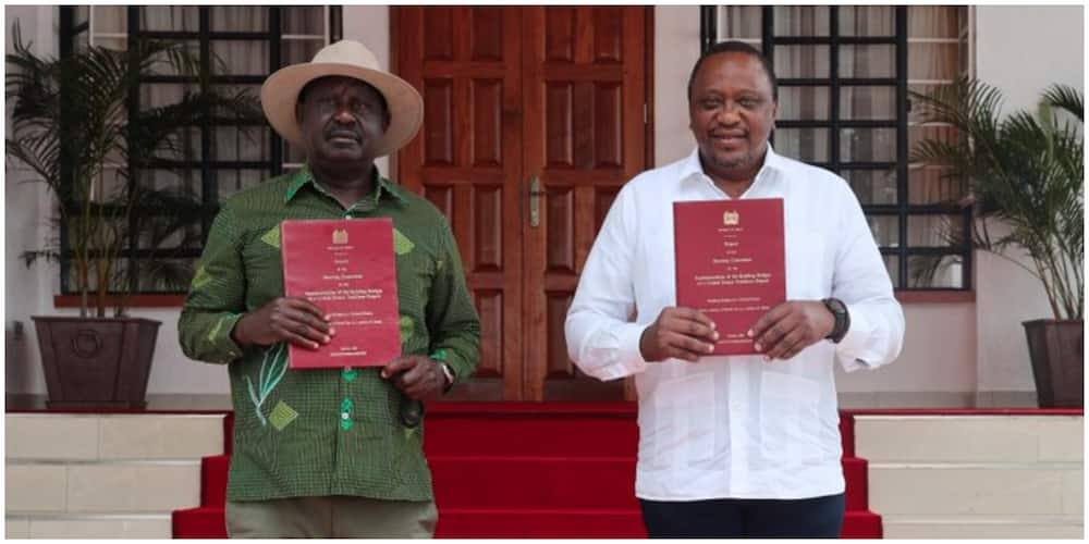 President Uhuru Kenyatta together with the ODM leader Raila Odinga displays the BBI report at Kisii state lodge on Wednesday, October 21. Photo: State House Kenya.