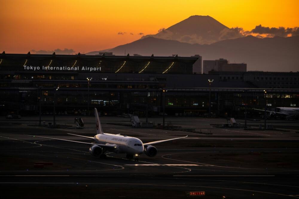 Japan Airlines has logged its first annual net profit in three years