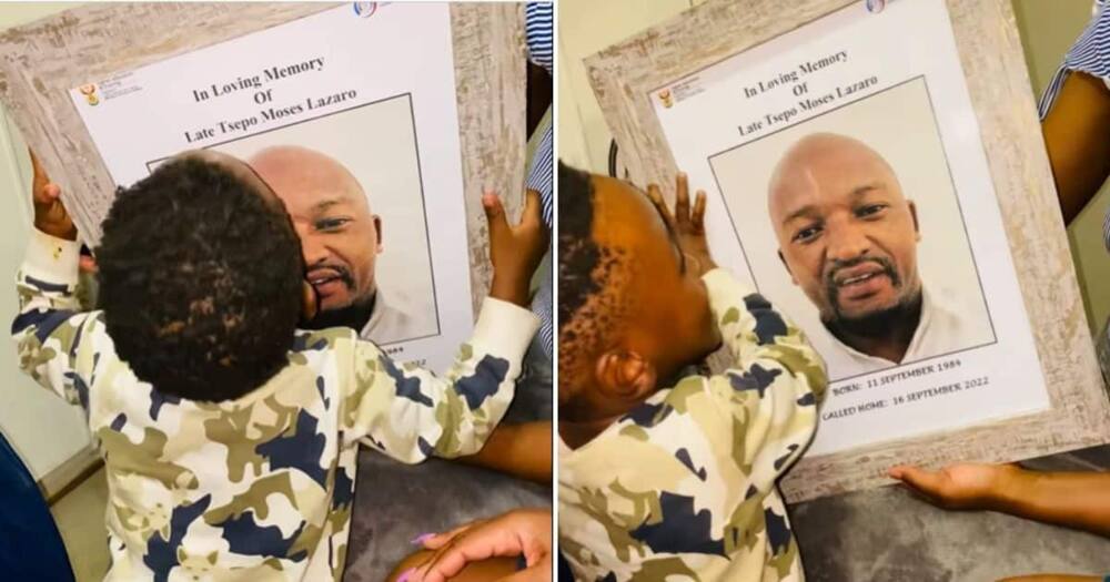 boy kissing memorial photo of dad