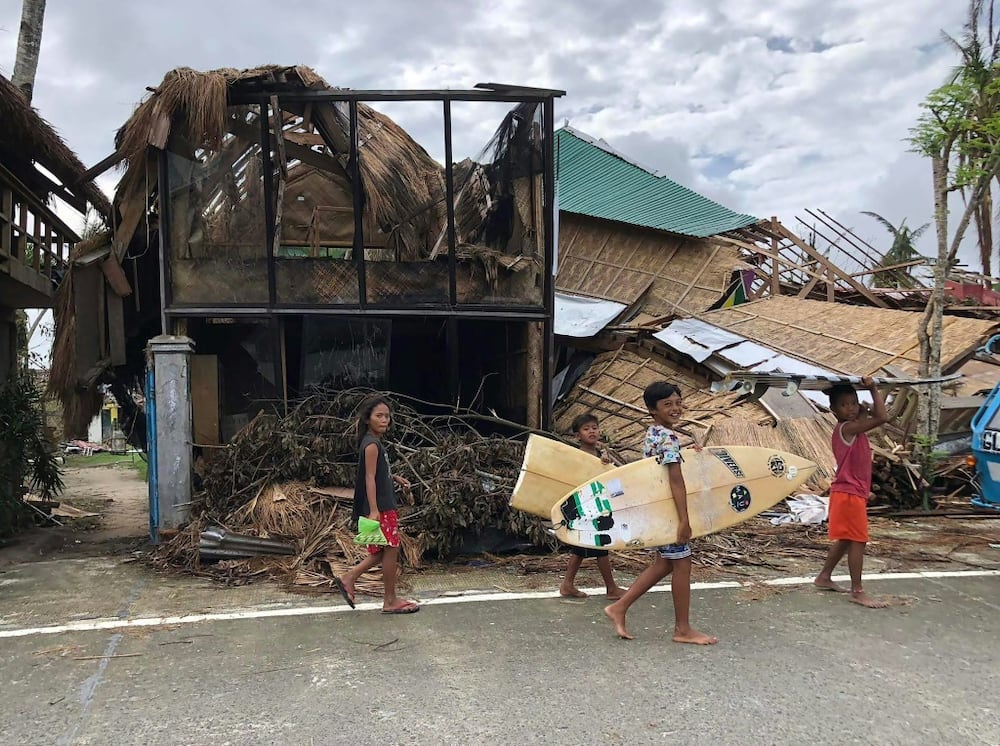 The wreckage of a home in General Luna town, Siargao island, in the Philippines in December 2021 following Typhoon Rai, one of a series of deadly storms over the year amid mounting concern on climate change