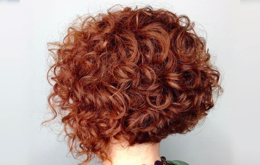 Woman with curly red bob hairstyle
