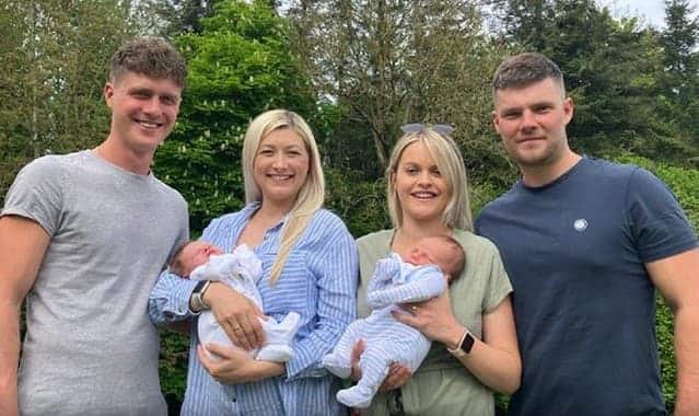 George and Joe Robinson and their wives, Ellie and Hayley photographed with their babies delivered two hours apart at the Worcestershire Royal Hospital.