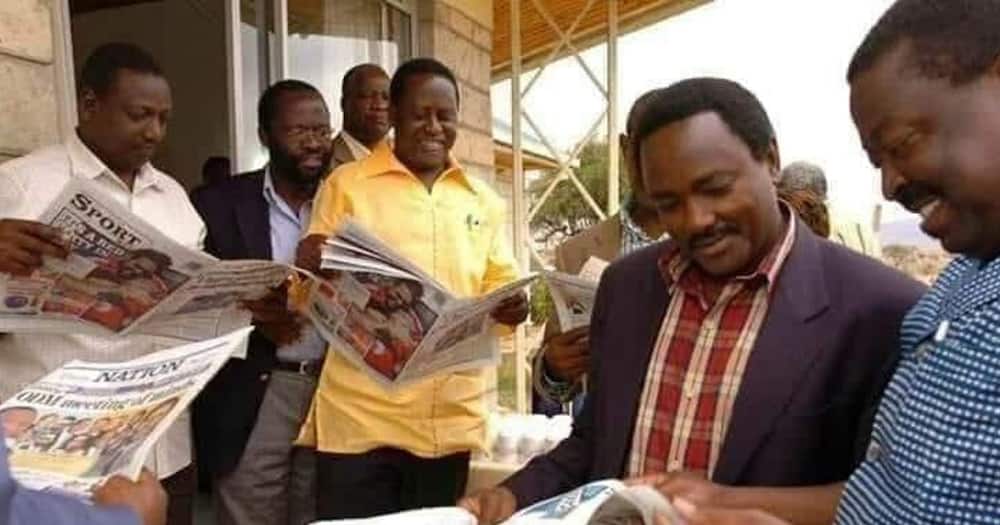 Raila Odinga in a yellow shirt, Kalonzo Musyoka in a checked shirt, Musalia Mudavadi and William Ruto in a white shirt.