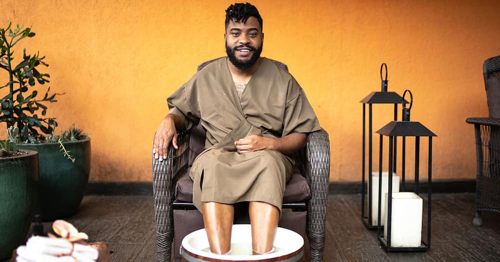 Man sitting in salon.