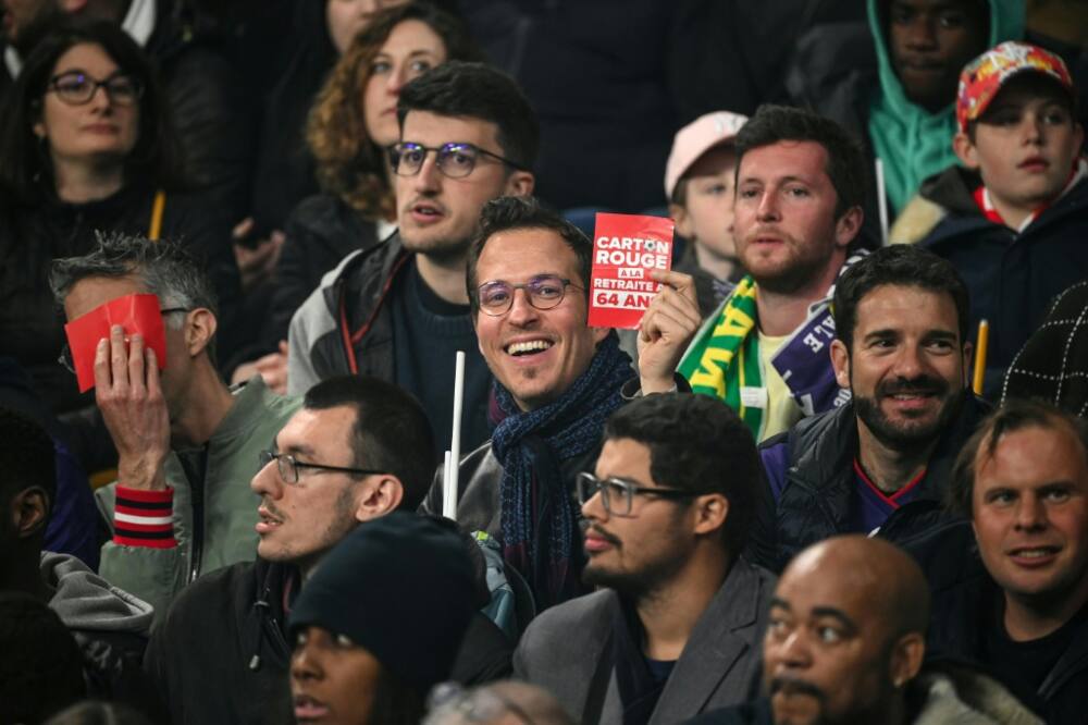 When Macron attended a football match on Saturday, some activists waved red cards at him in protest