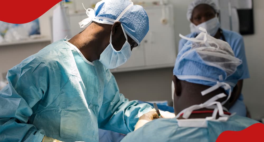 Doctors conducting surgery on a patient