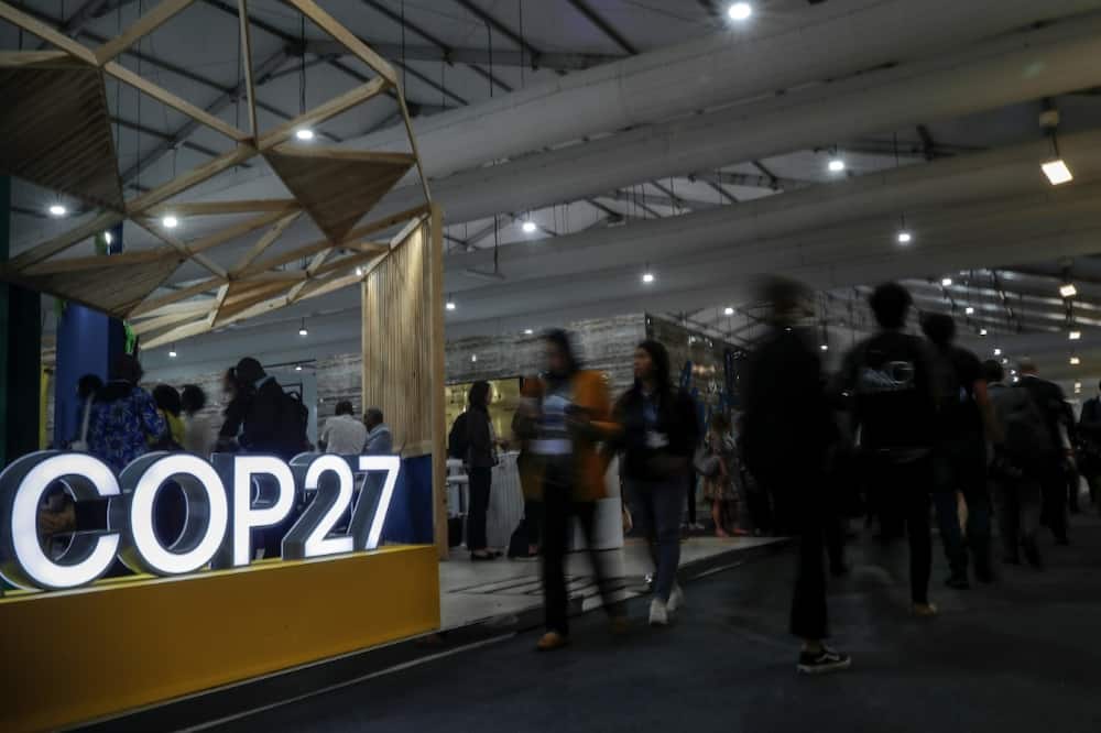 Participants walk inside the Sharm el-Sheikh International Convention Centre during the COP27 climate conference