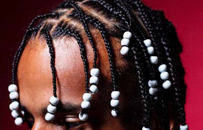 Beads in boy's hair?