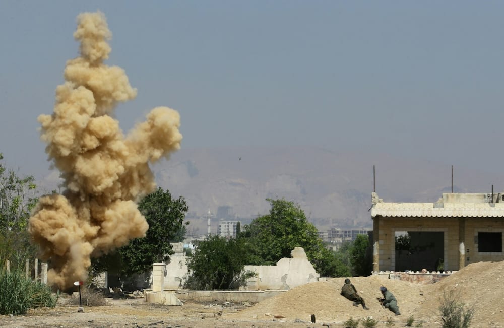 Ordnance is blown up during a training session to clear munitions in the countryside near the Syrian capital Damascus
