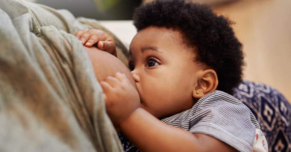 Black child breastfeeding. Photo for illustration.