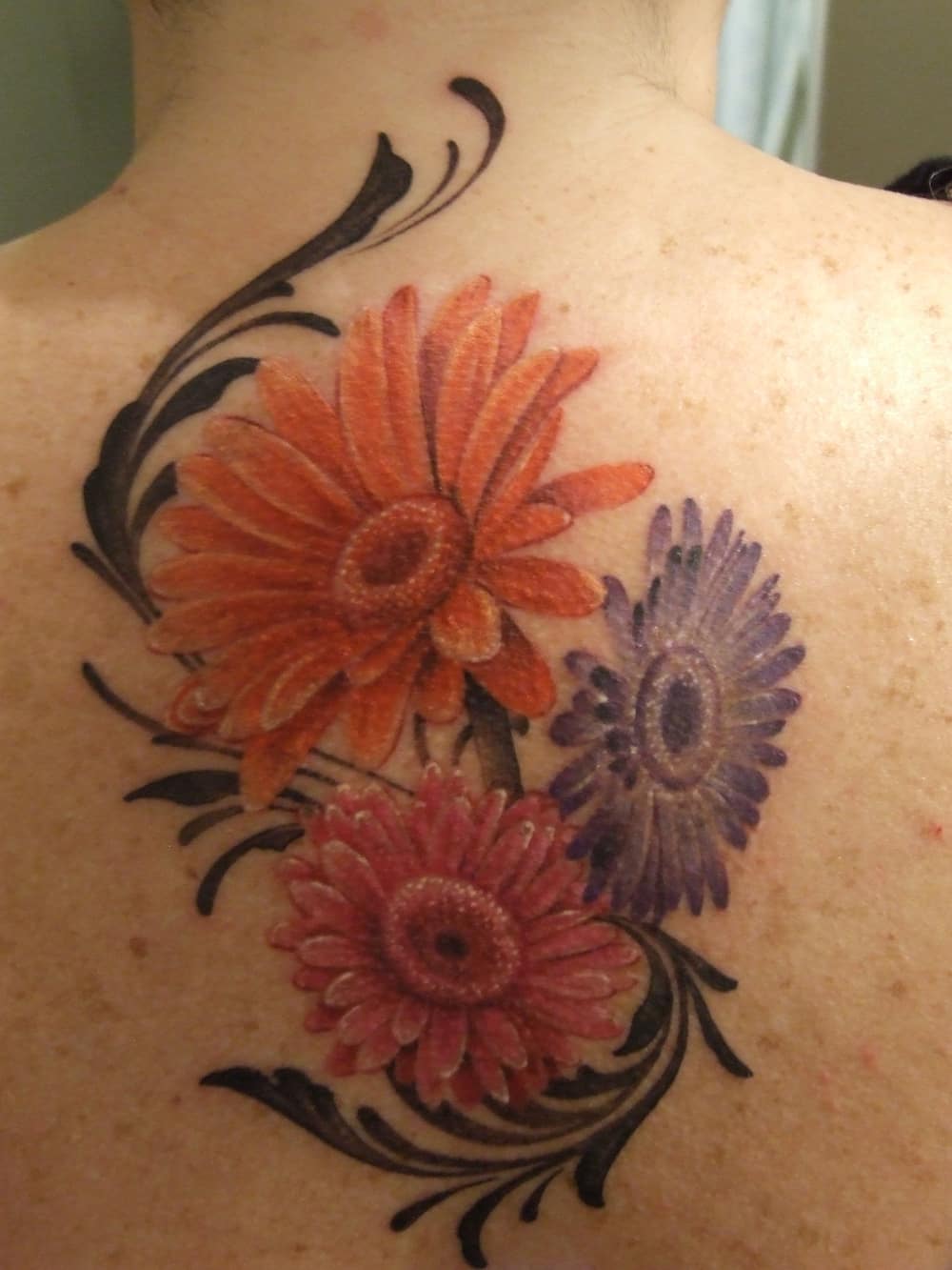 gerbera daisy watercolor tattoo