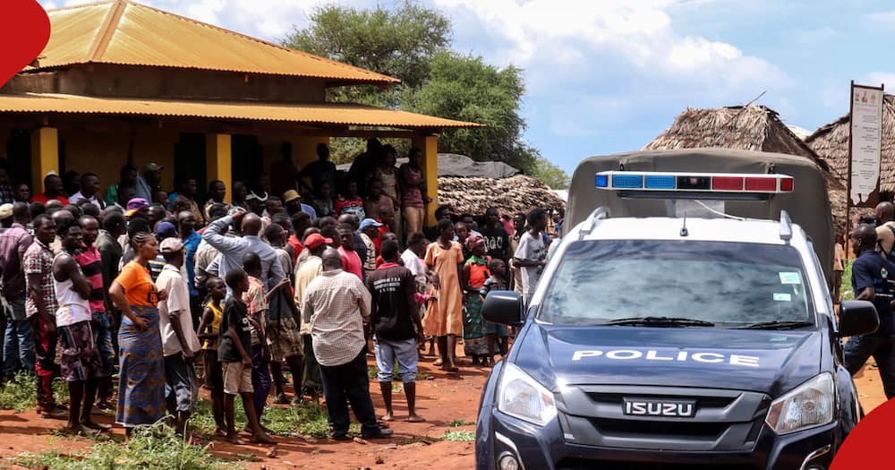 Villagers gather beside a police vehicle as they look at an area where a grenade exploded during an attack by a gang in Chakama village