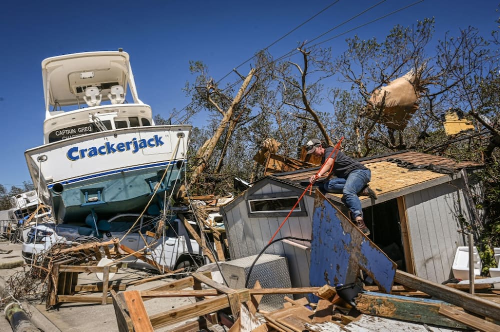 The force of the storm pushed boats ashore and dragged cars out to sea