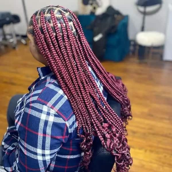 Burgundy knotless braids with curly ends