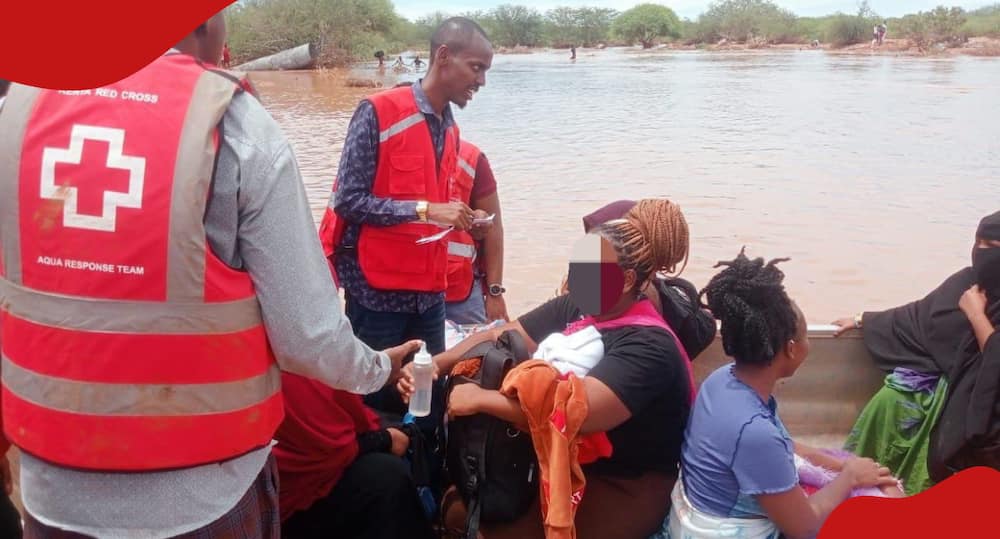 Kenya Red Cross personnel interact with survivors.