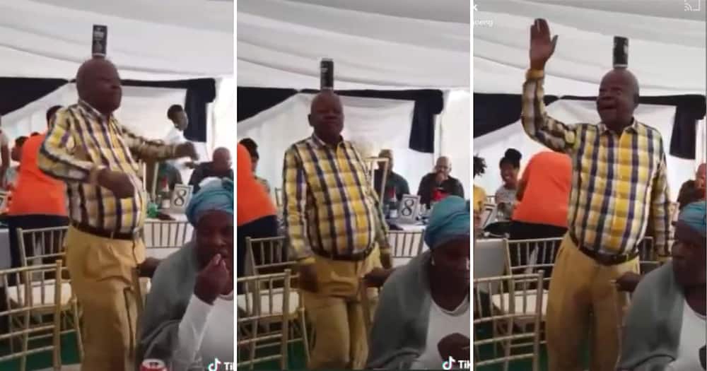 Old man dancing with a beer can on his head