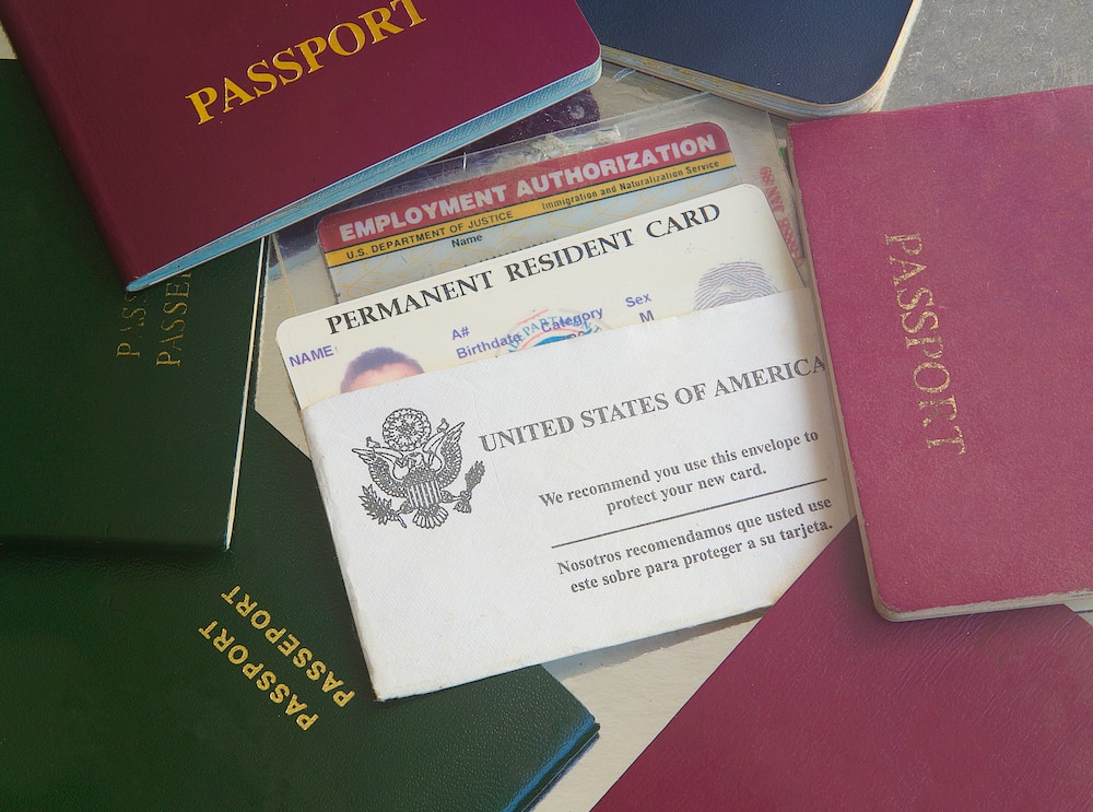 A green card is among group of passports from different countries
