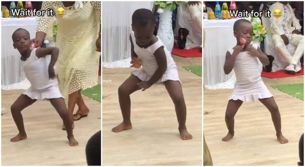 Smart black girl shows of accurate dance steps, picks money, puts it in her dress.