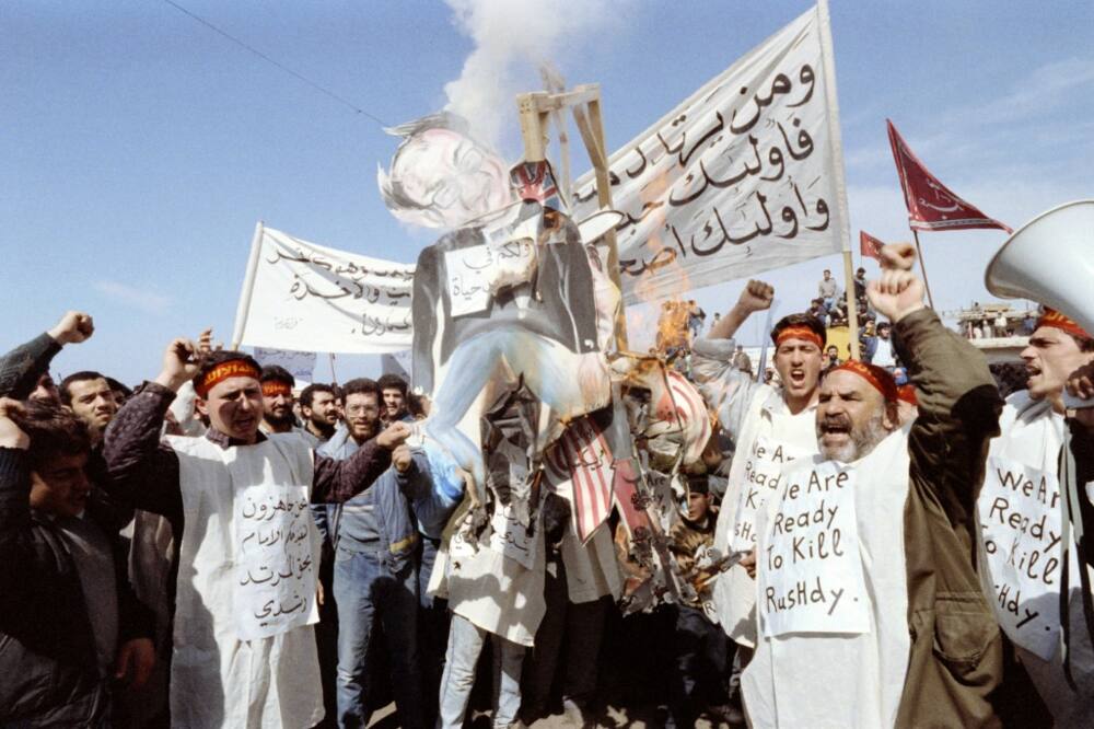 In this file photo taken on February 26, 1989, Pro-Iranian Hezbollah fundamentalists burn an effigie of Rushdie who they accuse of blasphemy for his "Satanic Verses" book